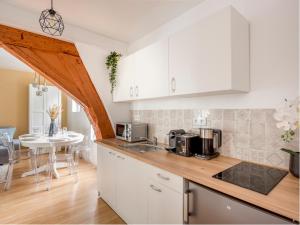 Kuchyňa alebo kuchynka v ubytovaní Merveil - Family Suite - Marais - Martin V