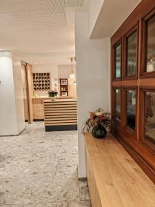 a hallway of a home with a kitchen and a dining room at Hotel Alpenblick in Sarntal
