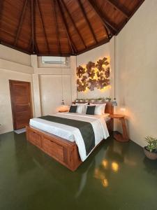 a bedroom with a large bed in a room at Romantic Jungle Hideaway in Tangalle