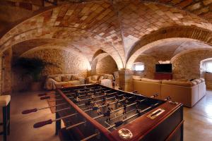 a large game room with a large billiard table at Mas Piarnau in Vilasacra