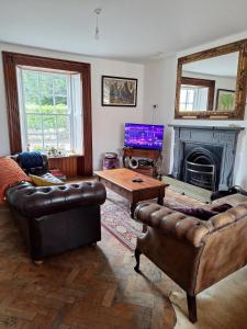 TV a/nebo společenská místnost v ubytování Charlotte House