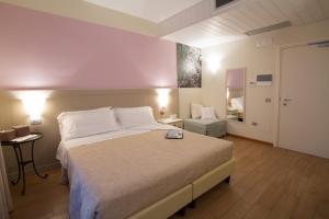 A bed or beds in a room at Agriturismo Ai Prati