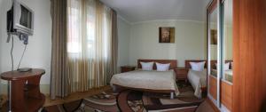 Postel nebo postele na pokoji v ubytování Zoriana