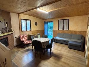 a living room with a couch and a table at Camping Montorfano in Montorfano