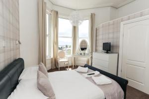 Postel nebo postele na pokoji v ubytování Nethway Hotel