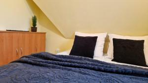 Posteľ alebo postele v izbe v ubytovaní Pokoje Apartamenty Pod Limbą