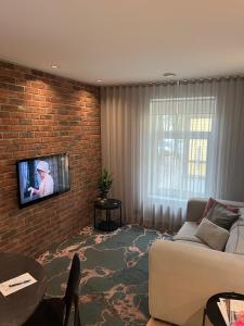 Μια τηλεόραση ή/και κέντρο ψυχαγωγίας στο New Apartment in Kadriorg, Tallinn City Centre