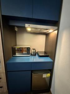 Kuchyň nebo kuchyňský kout v ubytování Greatwood Residence at Devonshire