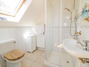 a bathroom with a shower and a toilet and a sink at Mill House  +34 photos