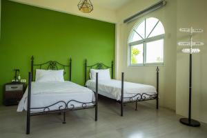 Lova arba lovos apgyvendinimo įstaigoje Ding Shian B&B