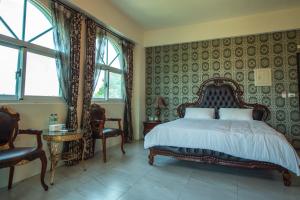 Posteľ alebo postele v izbe v ubytovaní Ding Shian B&B