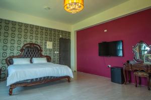 Televizorius ir (arba) pramogų centras apgyvendinimo įstaigoje Ding Shian B&B