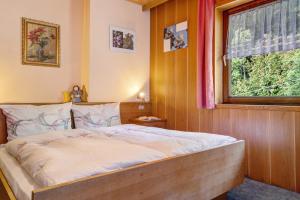 Postel nebo postele na pokoji v ubytování Mittermüllerhof Feldthurns + 64 fotografií
