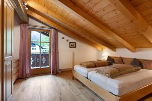 a bedroom with a bed and a large window at Kramer in Garmisch-Partenkirchen