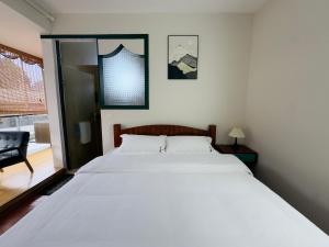 Postel nebo postele na pokoji v ubytování Xunyan B&B