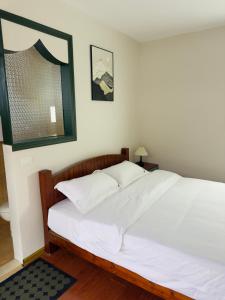 Postel nebo postele na pokoji v ubytování Xunyan B&B