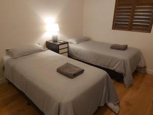 Postel nebo postele na pokoji v ubytování 28-32 Boisdale 2 Br