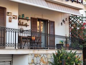 a balcony of a house with a table and chairs at Green house in Chrisso in Khrisón