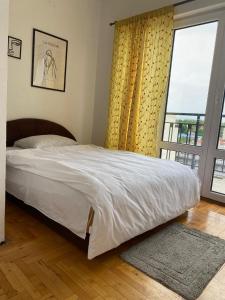 Postel nebo postele na pokoji v ubytování Apartment Rooms Niva