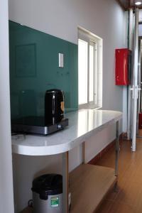 a table with a microwave on top of it at Khách sạn Phan văn 1 in Danang