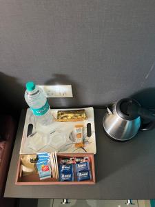 a bottle of water sitting on top of a table at H2cottage in Wodapatti