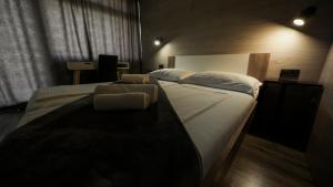 Postel nebo postele na pokoji v ubytování Hotel Matija Gubec