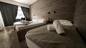 Postel nebo postele na pokoji v ubytování Hotel Matija Gubec