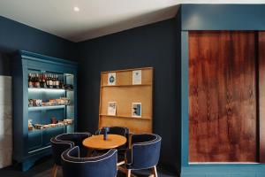 a dining room with a table and chairs at Velamar Boutique Hotel - Adults Friendly in Albufeira