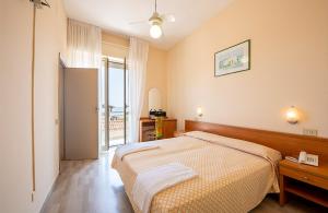 En eller flere senge i et værelse på Silvi Marina Sea Resort