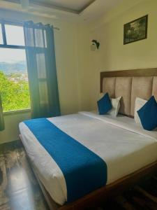 Postel nebo postele na pokoji v ubytování Hotel Royal Orbit By Arony Hospitality Dehradun