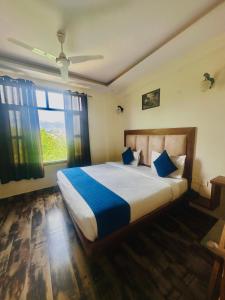 Postel nebo postele na pokoji v ubytování Hotel Royal Orbit By Arony Hospitality Dehradun