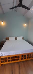 Ένα ή περισσότερα κρεβάτια σε δωμάτιο στο Mountara Homestay