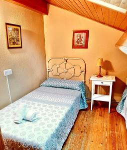 Postel nebo postele na pokoji v ubytování Casa Pelayo 2