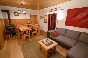a living room with a couch and a table at Ferienwohnung Frisch in Lam