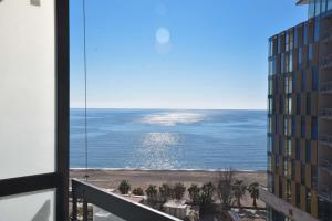 a view of the ocean from a balcony of a building at CASA AL MARE RESIDENCE in Bečići