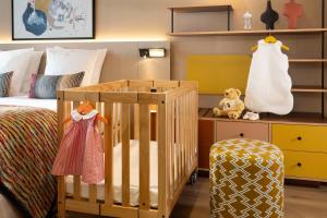 Ein Bett oder Betten in einem Zimmer der Unterkunft Yuna Montmartre - ApartHotel