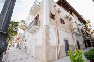 a building on the side of a street at B&B Riccioli D'oro in Margherita di Savoia