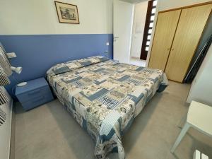 Ένα ή περισσότερα κρεβάτια σε δωμάτιο στο App4rent Villa Zanetti - Appartamenti con spiaggia privata frontemare