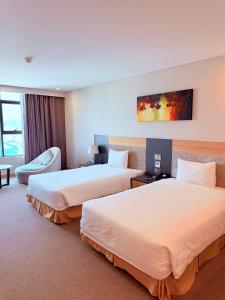 Postel nebo postele na pokoji v ubytování Muong Thanh Luxury Nha Trang Hotel