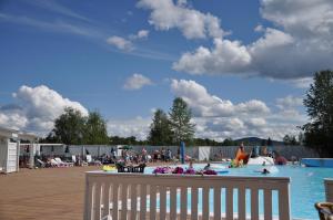 a pool with people playing in the water at Kraja in Arjeplog