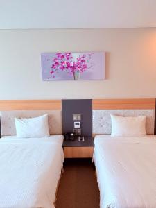 Postel nebo postele na pokoji v ubytování Muong Thanh Luxury Nha Trang Hotel