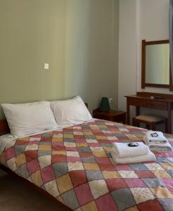 A bed or beds in a room at Mesohori studios