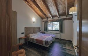 Postel nebo postele na pokoji v ubytování Apartaments i Bungalows Càmping L'Orri del Pallars + 37 fotografií