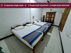 Letto o letti in una camera di AHSRAM Accommodations