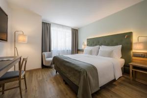 Posteľ alebo postele v izbe v ubytovaní Hotel IMLAUER & Bräu