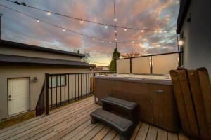 a deck with a bar on a house at Bright Modern Home - King Bed - Free Parking - Fireplace - Fast Wi-Fi - Free Netflix in Edmonton +10 photos