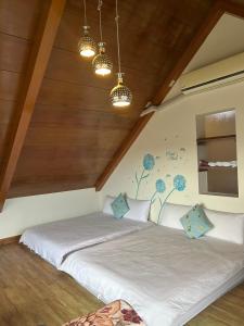 Giường trong phòng chung tại Xian Qing Yu Zhi Homestay