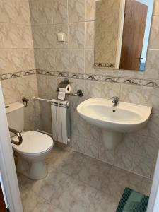 a bathroom with a toilet and a sink at Rybitwa in Dziwnów +71 photos