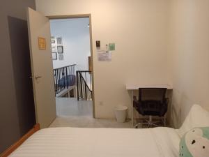 Postel nebo postele na pokoji v ubytování Chow Kit Neighborhood Hostel in Kuala Lumpur