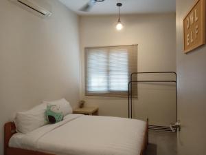 Postel nebo postele na pokoji v ubytování Chow Kit Neighborhood Hostel in Kuala Lumpur